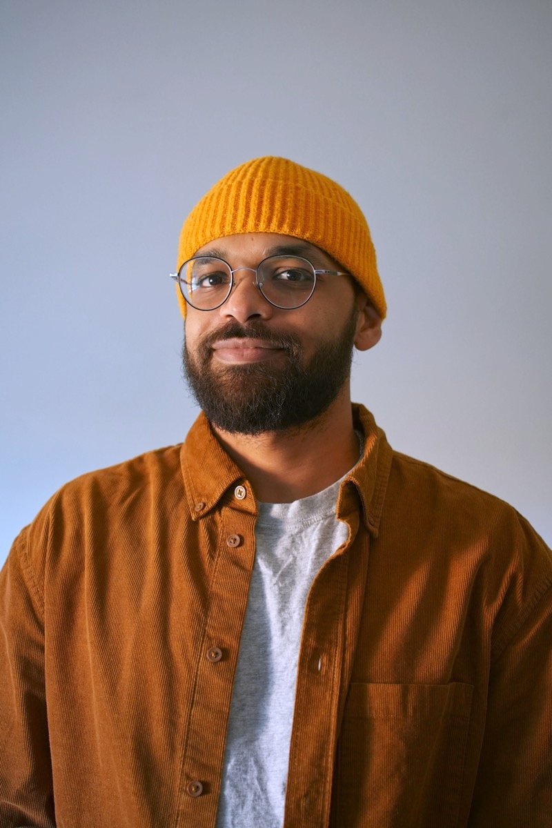 Moe Dafalla in a mustard beanie